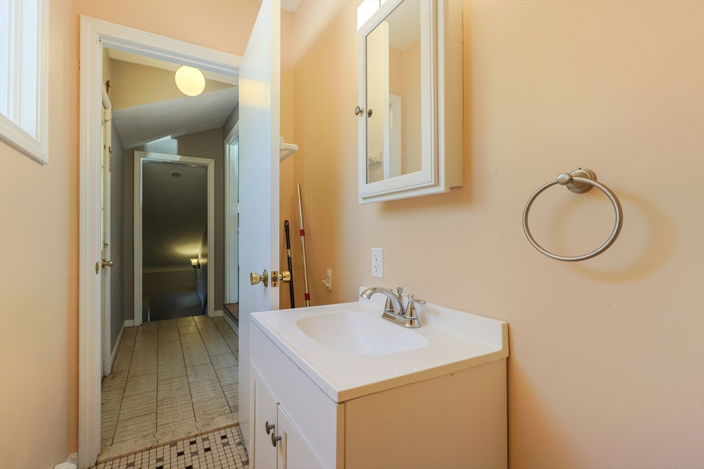 128 Salem Road Billerica, MA 01821 - Photo 31 of 42 a bathroom with a sink and a mirror