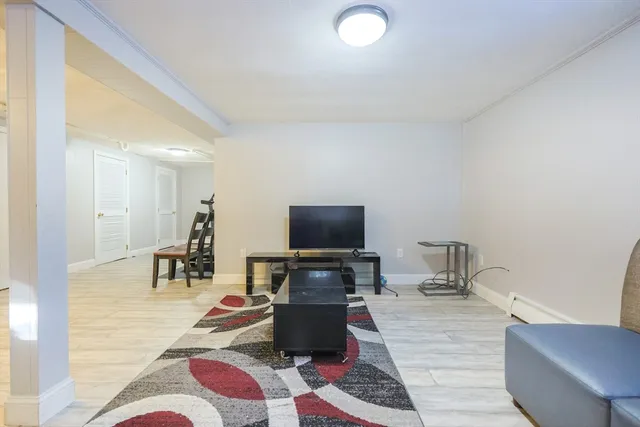 a living room with a couch and a flat screen tv