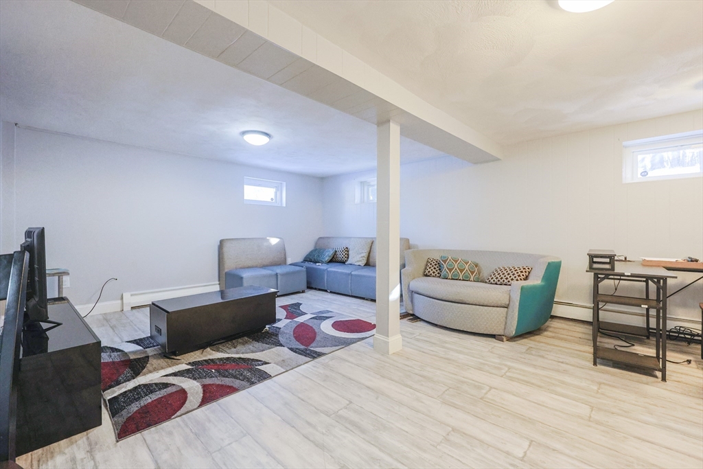 128 Salem Road Billerica, MA 01821 - Photo 35 of 42 a living room with furniture and wooden floor