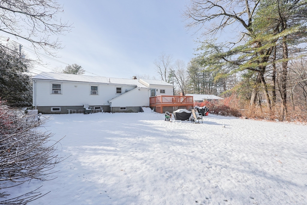 128 Salem Road Billerica, MA 01821 - Photo 42 of 42 a front view of a house with a yard covered in snow