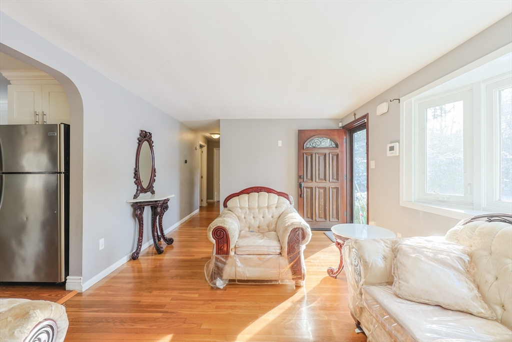 128 Salem Road Billerica, MA 01821 - Photo 7 of 42 a living room with furniture and a window