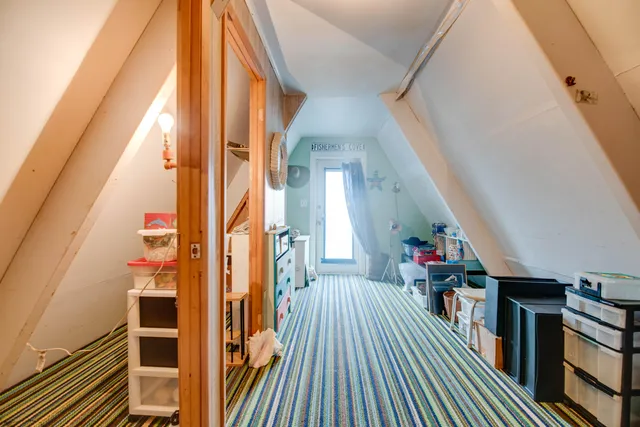 a view of a balcony with wooden floor and stairs