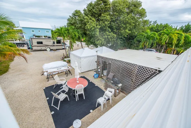 a view of a chairs and table on the patio