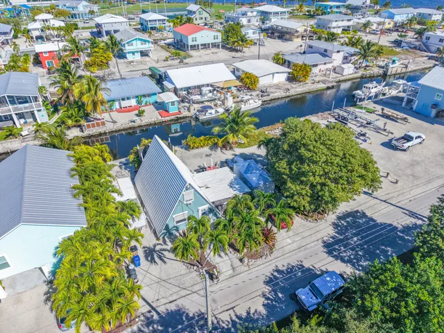 an aerial view of a houses with outdoor space
