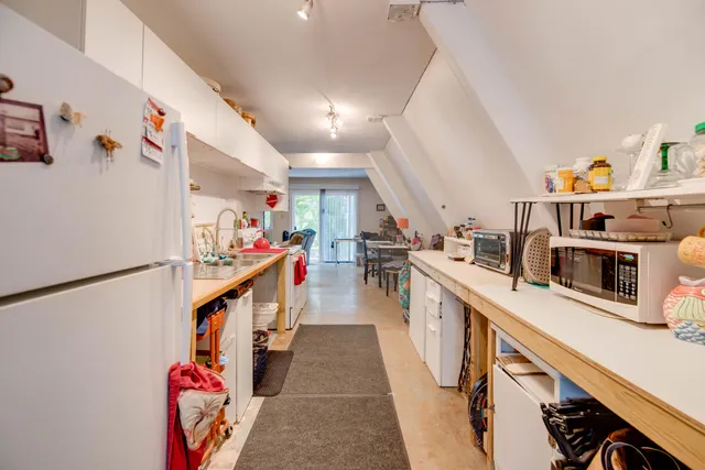 a kitchen with stainless steel appliances granite countertop lots of counter top space