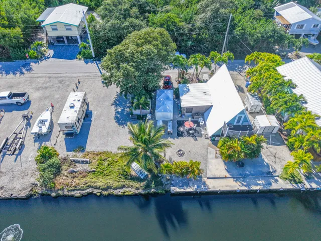 an aerial view of a house with outdoor space