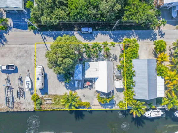 an aerial view of a house with lake view