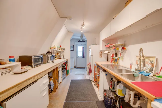 a view of a kitchen with sink and dishwasher