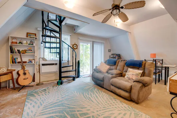 a bedroom with furniture and a chandelier