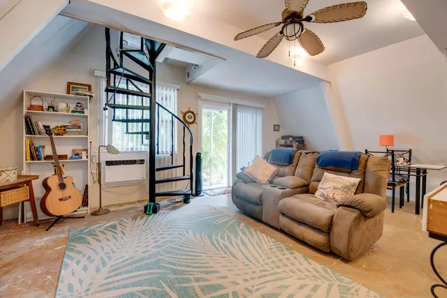 a bedroom with furniture and a chandelier