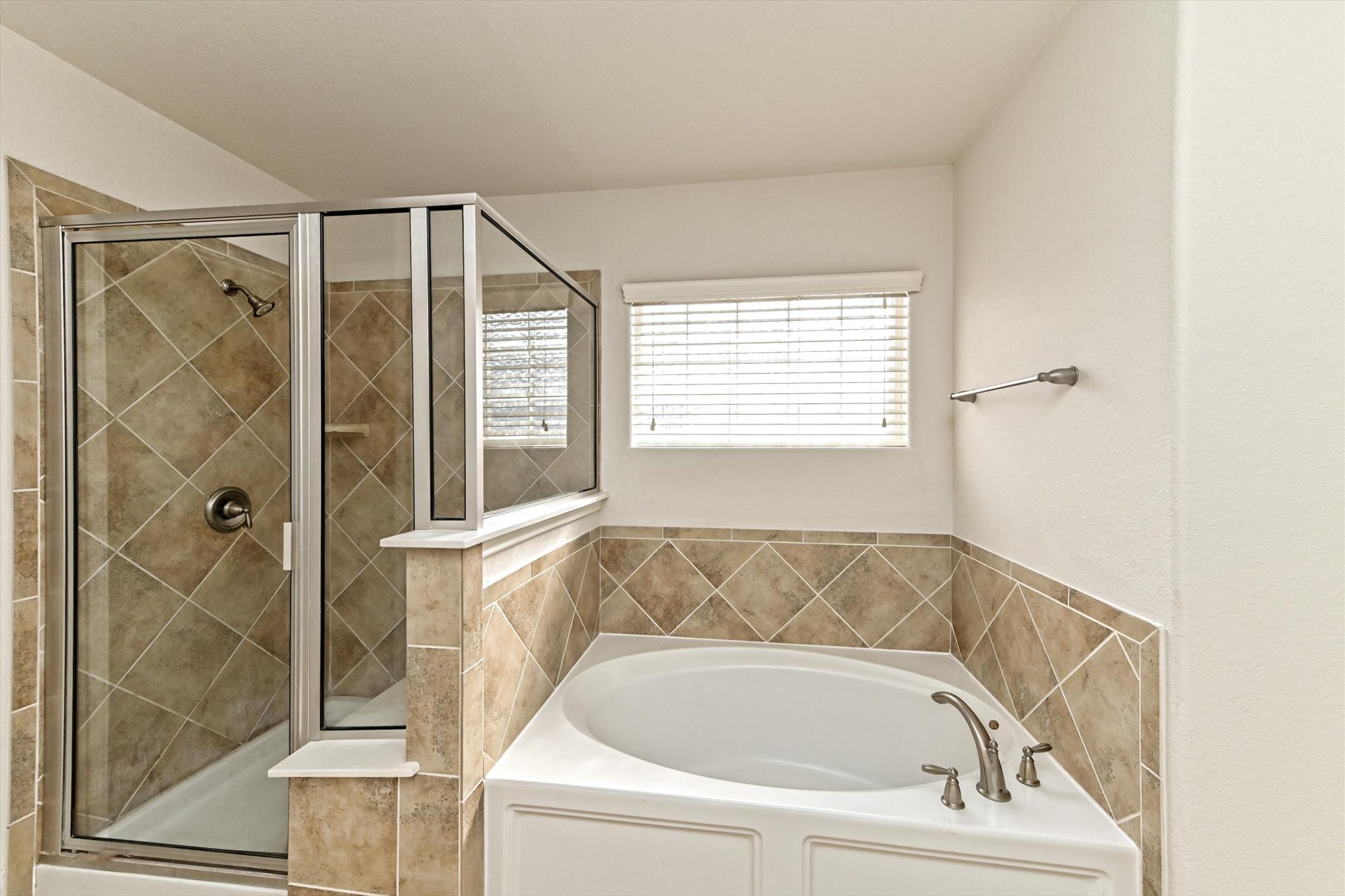 31 Stone Terrace Drive Austin, TX 78734 - Photo 21 of 29 Bathroom with a bath and a shower stall