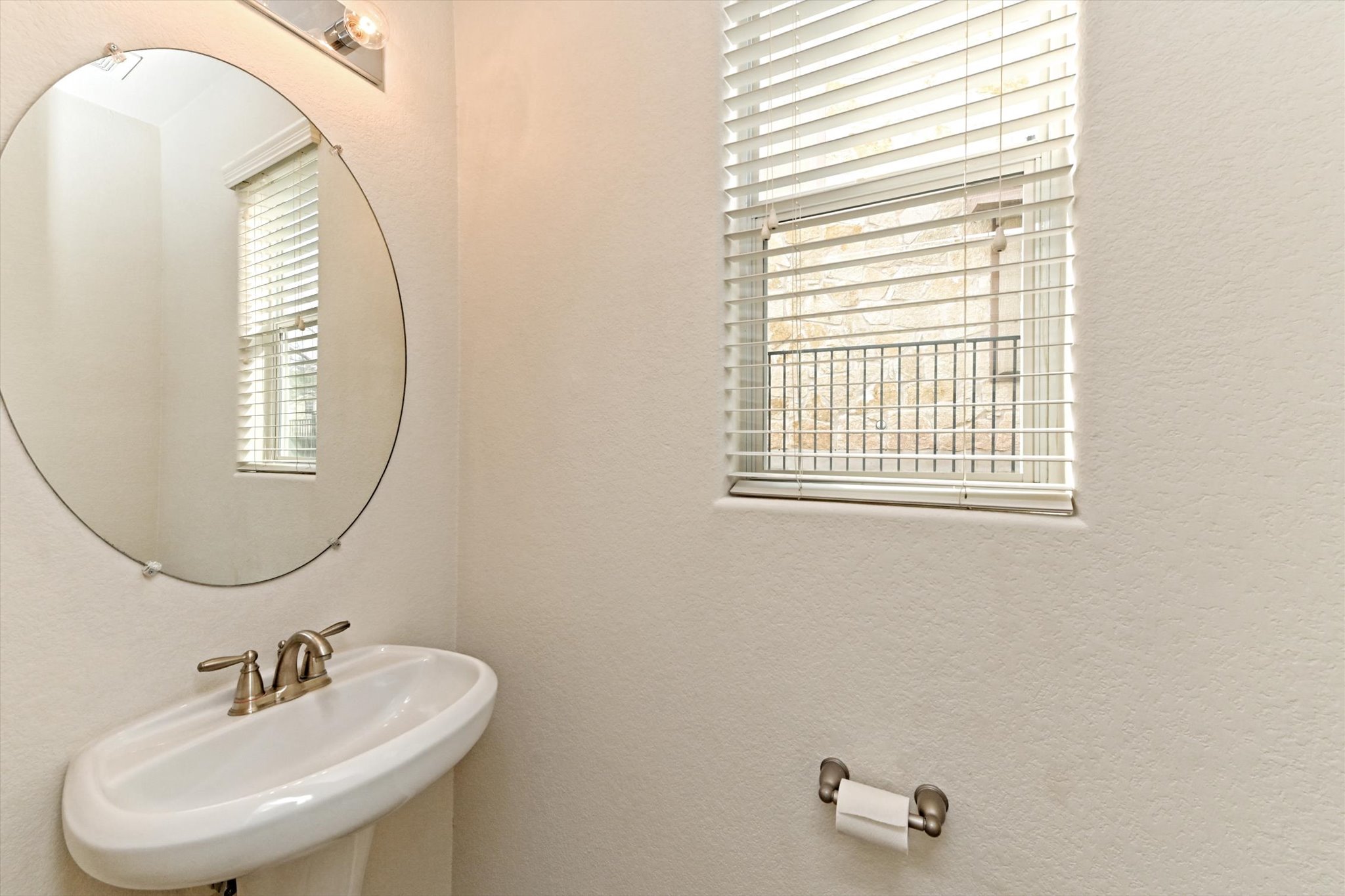 31 Stone Terrace Drive Austin, TX 78734 - Photo 27 of 29 Half bath featuring a textured wall and healthy amount of natural light