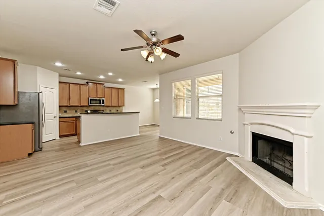 a view of a kitchen with a stove cabinets and wooden floor