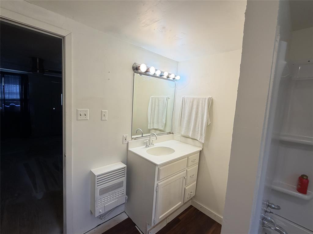 267 North Katy Road Elm Mott, TX 76640 - Photo 13 of 21 Bathroom with white vanity, integrated sink, and fixtures