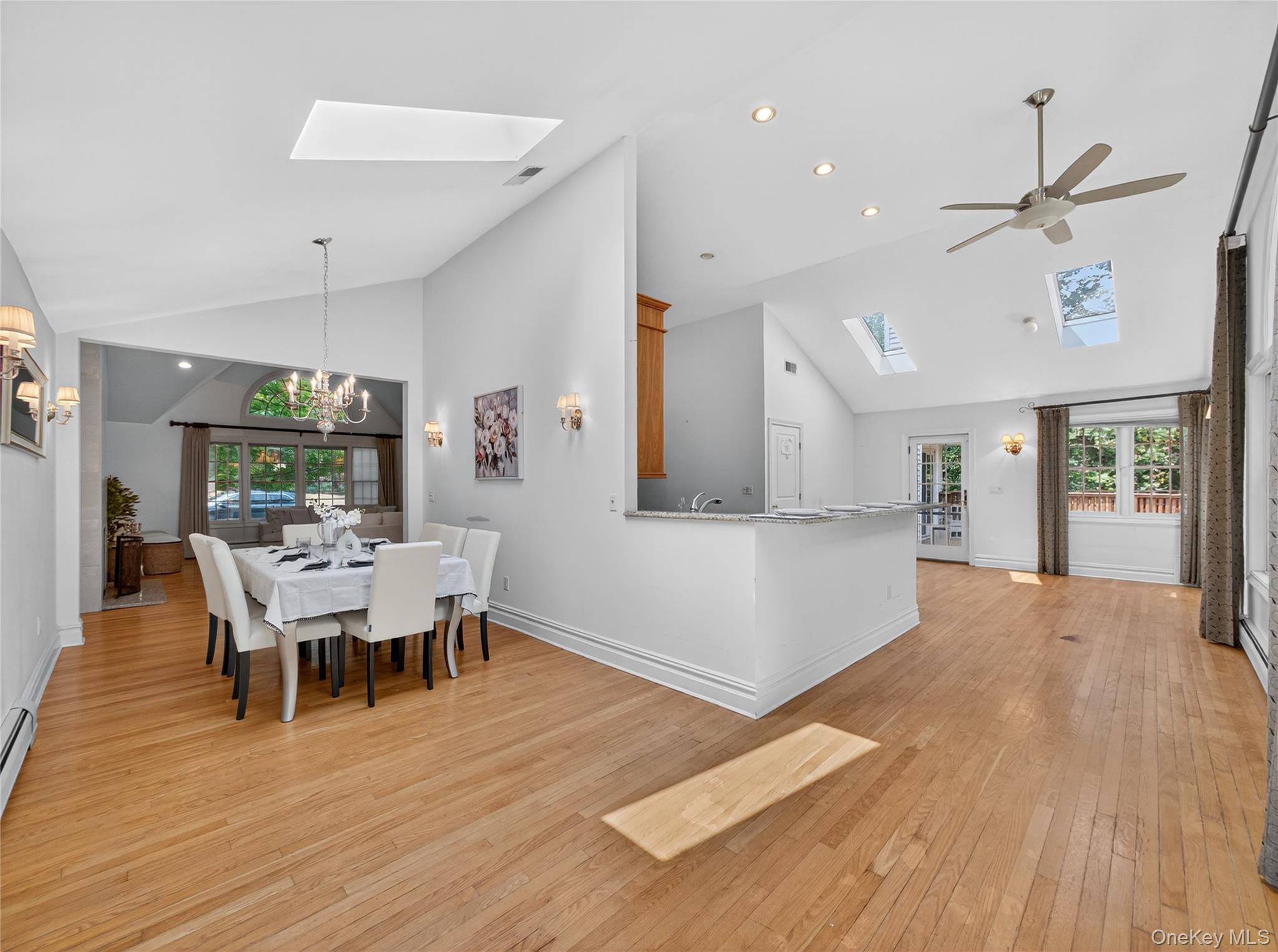 516 Oak Tree Road Palisades, NY 10964 - Photo 11 of 38 a view of a dining room with furniture window and wooden floor