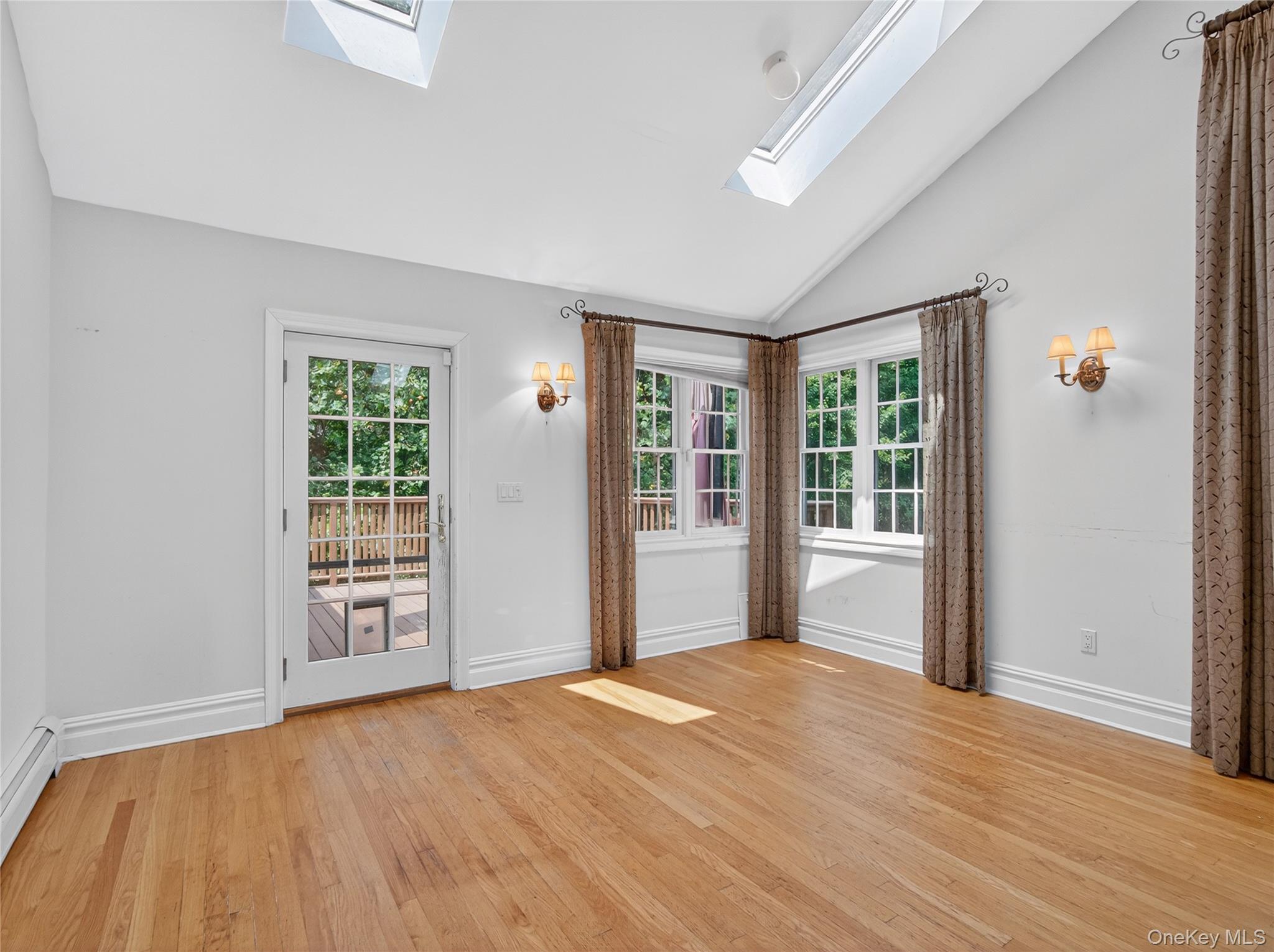 516 Oak Tree Road Palisades, NY 10964 - Photo 13 of 38 wooden floor and windows in an empty room