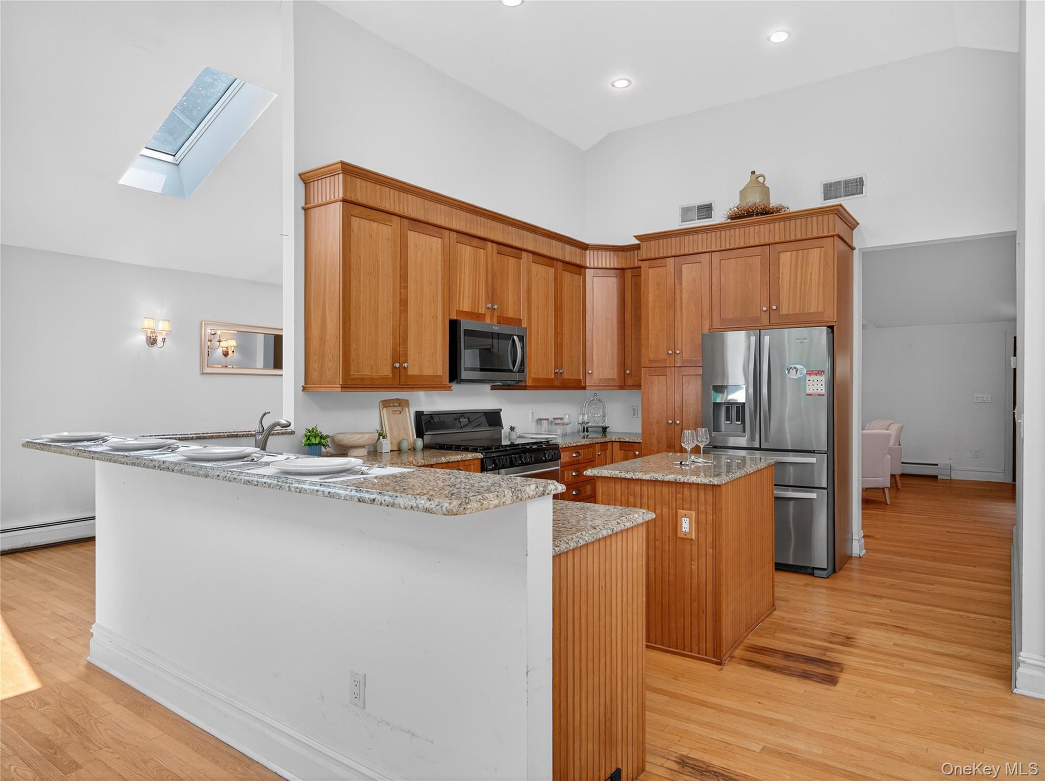 516 Oak Tree Road Palisades, NY 10964 - Photo 14 of 38 a kitchen with stainless steel appliances granite countertop a sink stove and refrigerator