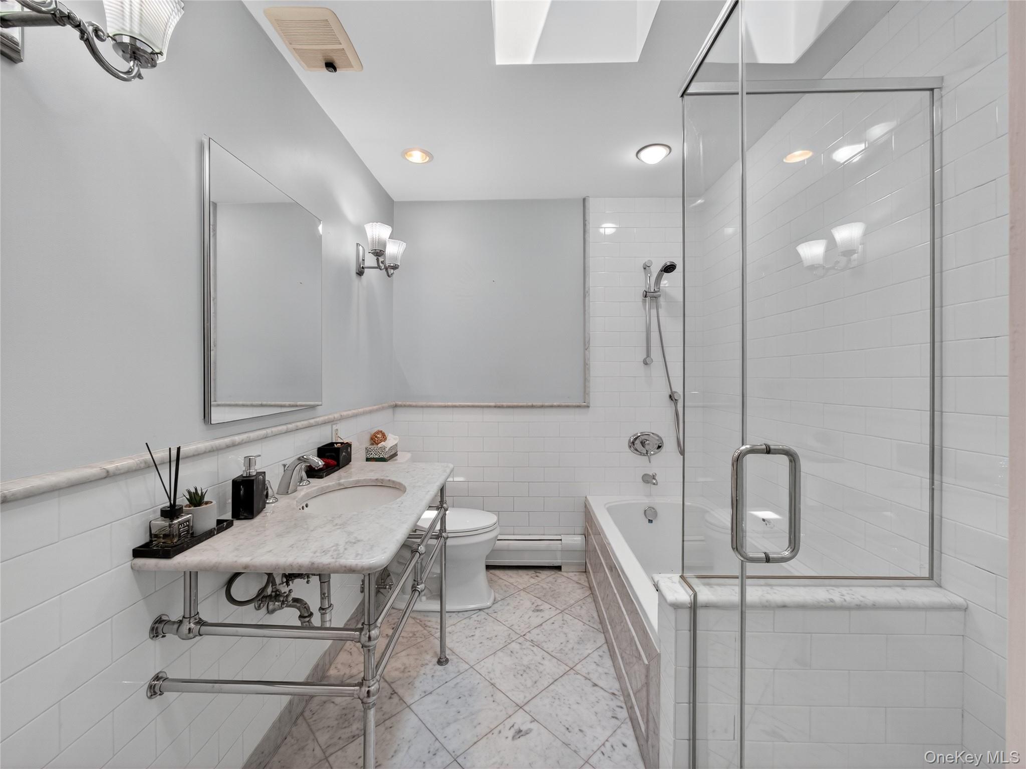 516 Oak Tree Road Palisades, NY 10964 - Photo 18 of 38 a bathroom with a sink a toilet and shower