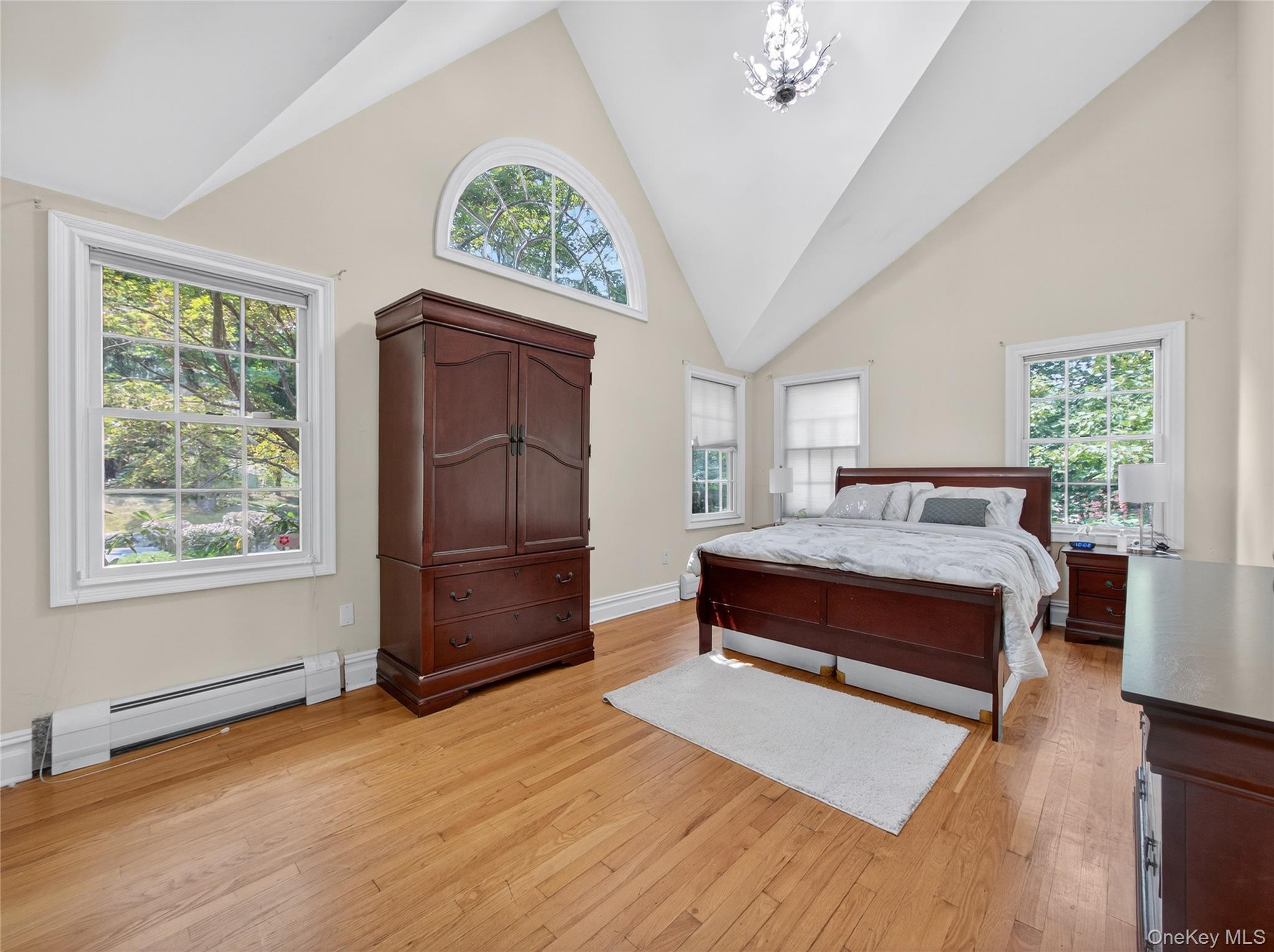516 Oak Tree Road Palisades, NY 10964 - Photo 19 of 38 a spacious bedroom with a bed and a window