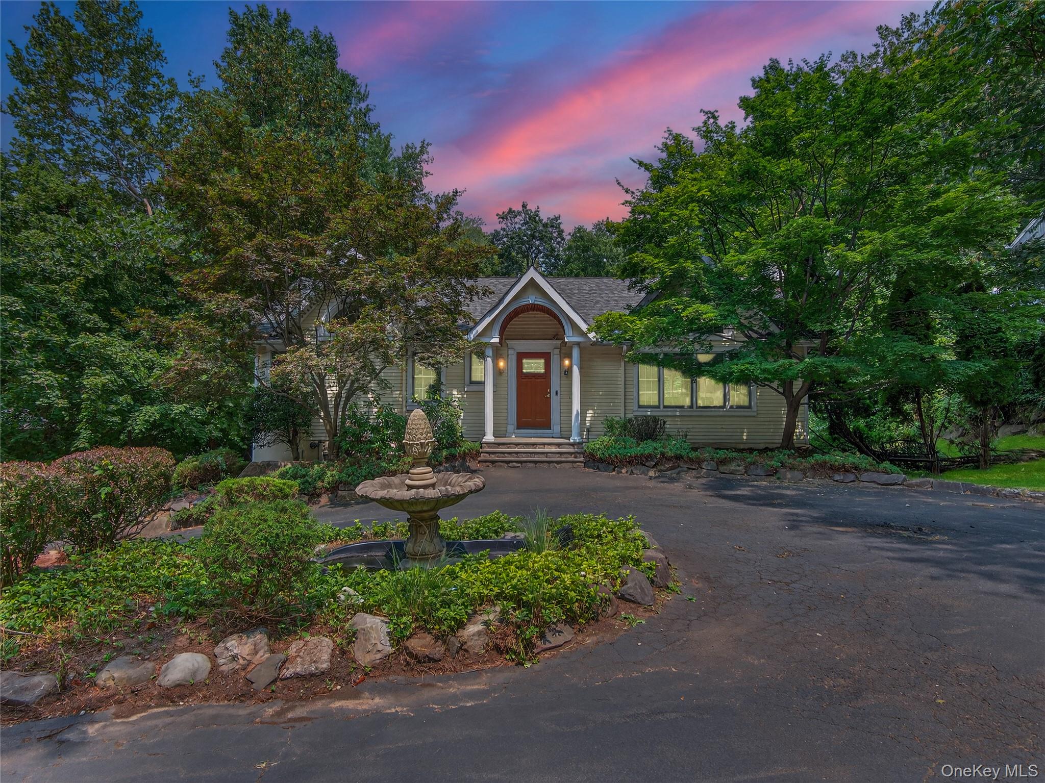 516 Oak Tree Road Palisades, NY 10964 - Photo 2 of 38 a front view of a house with garden