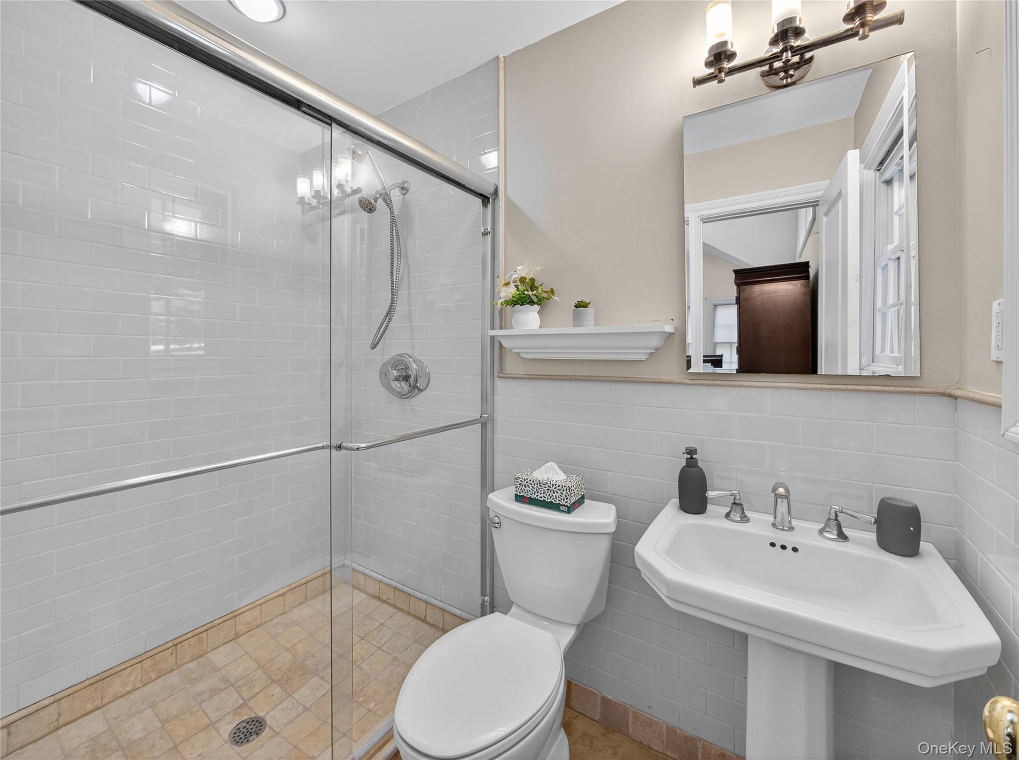 516 Oak Tree Road Palisades, NY 10964 - Photo 21 of 38 a bathroom with a sink a toilet and shower