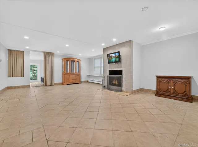 a view of entryway with wooden floor and windows