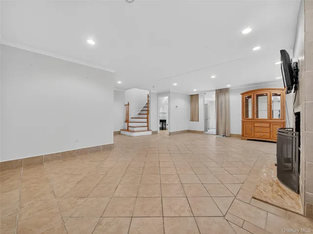 a view of an empty room with a fireplace