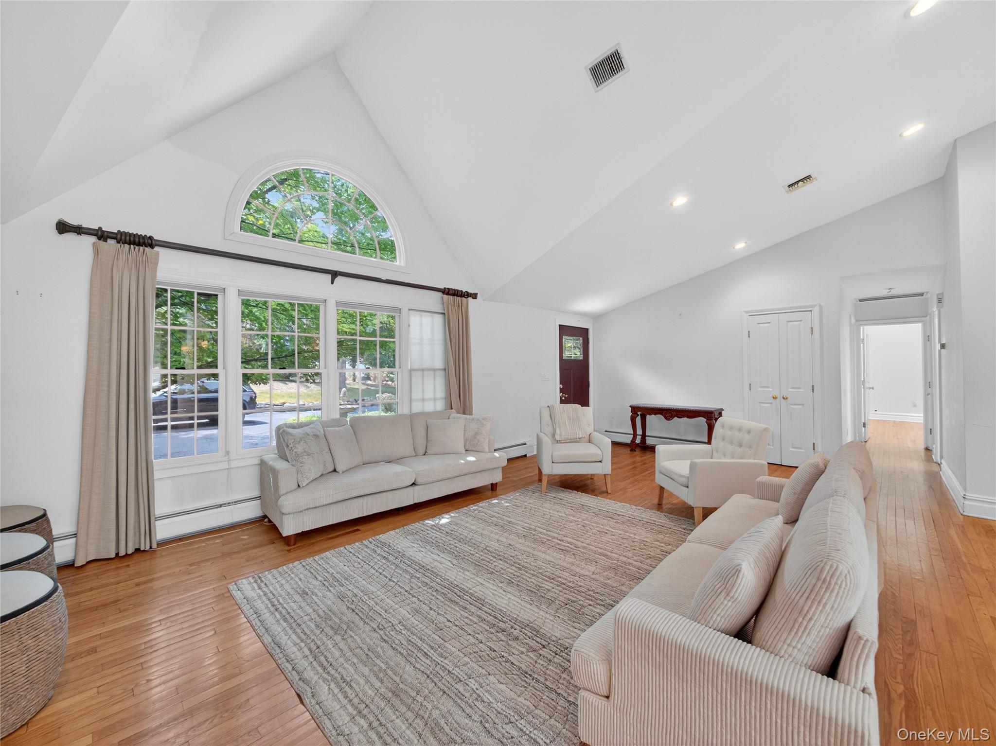 516 Oak Tree Road Palisades, NY 10964 - Photo 8 of 38 a living room with furniture and a large window