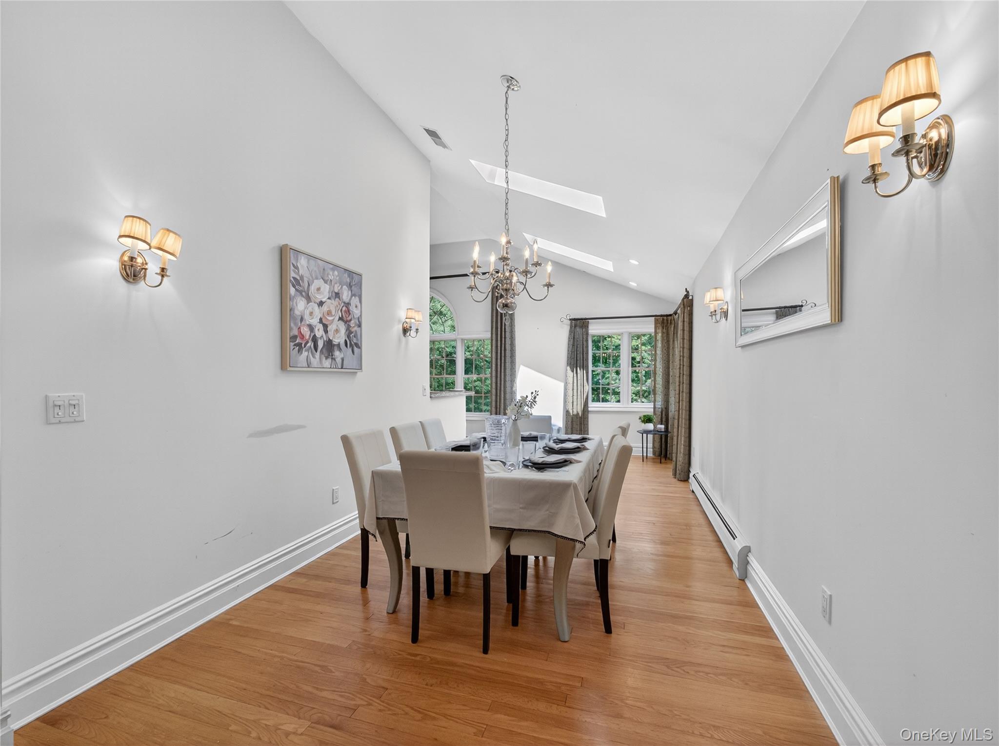 516 Oak Tree Road Palisades, NY 10964 - Photo 10 of 38 a view of a dining room with furniture window and wooden floor