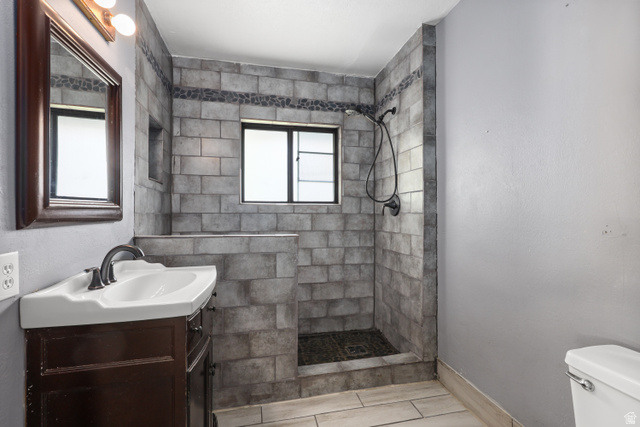 2576 Gramercy Avenue Ogden, UT 84401 - Photo 17 of 20 Bathroom featuring vanity and tiled shower