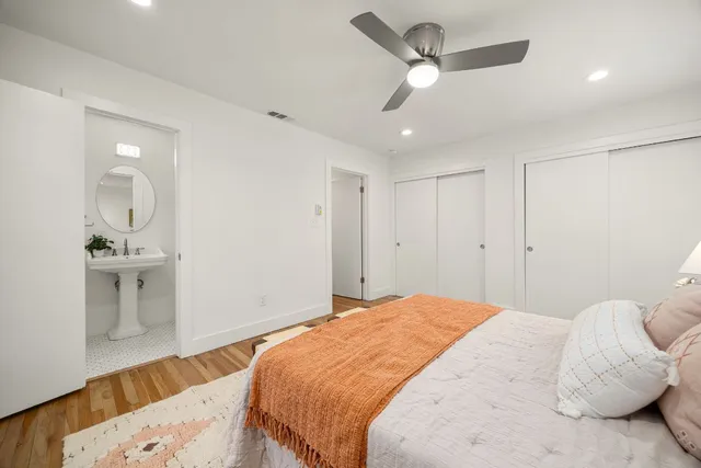 a bedroom with a bed and a view of bathroom