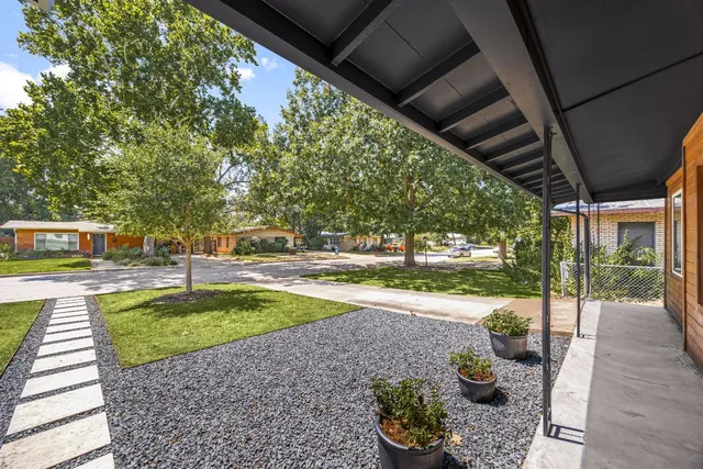 a house with swimming pool in front of it