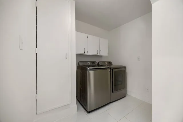 a utility room with washer and dryer