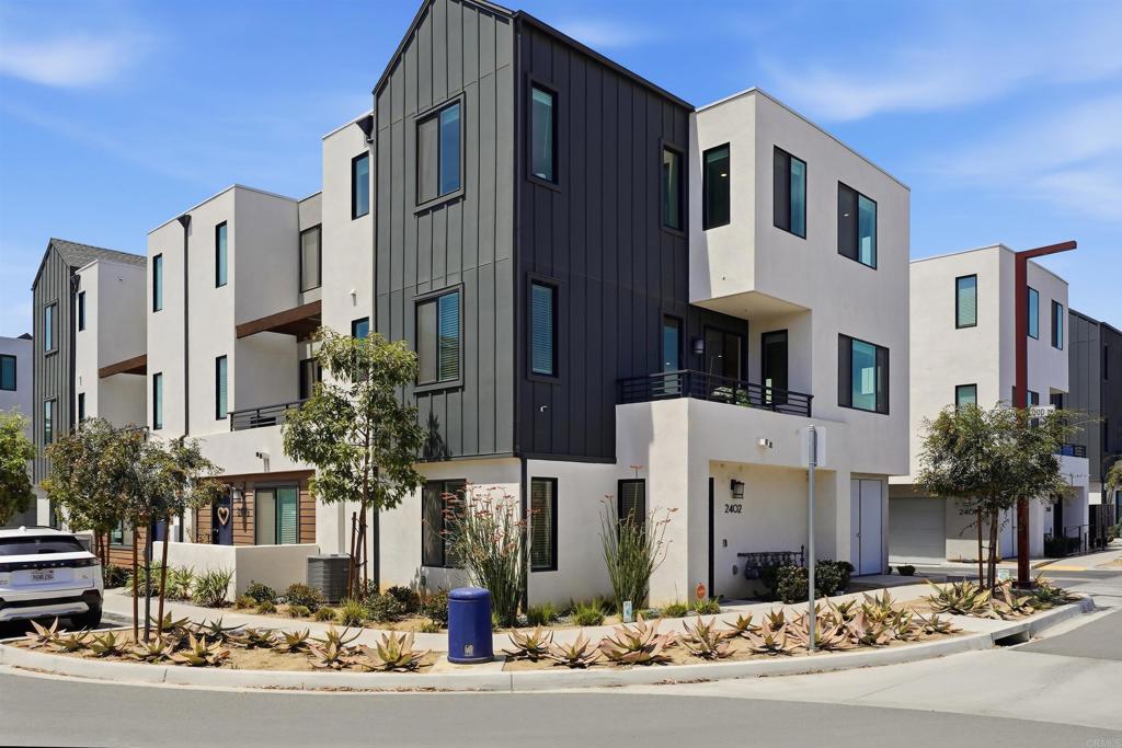 2402 Cascalote Loop San Diego, CA 92154 - Photo 34 of 35 a front view of a building with street view