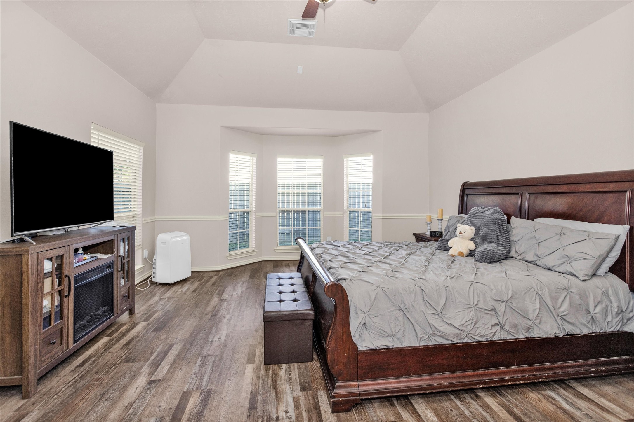 30110 Legends Ridge Drive Spring, TX 77386 - Photo 22 of 49 a bedroom with a bed and a flat screen tv