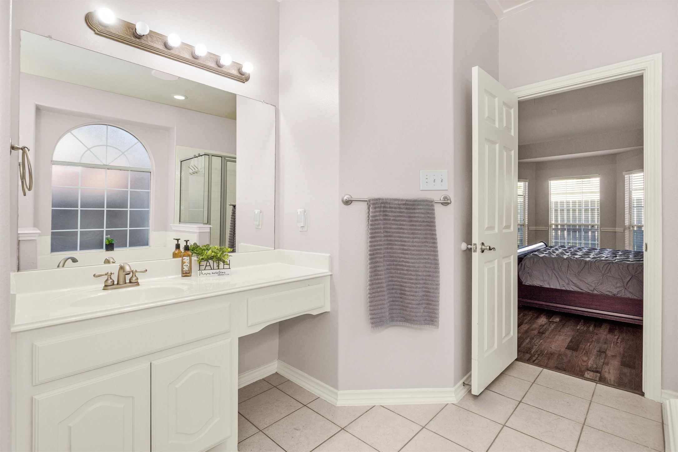 30110 Legends Ridge Drive Spring, TX 77386 - Photo 26 of 49 a en suite bathroom with a sink a mirror and a shower