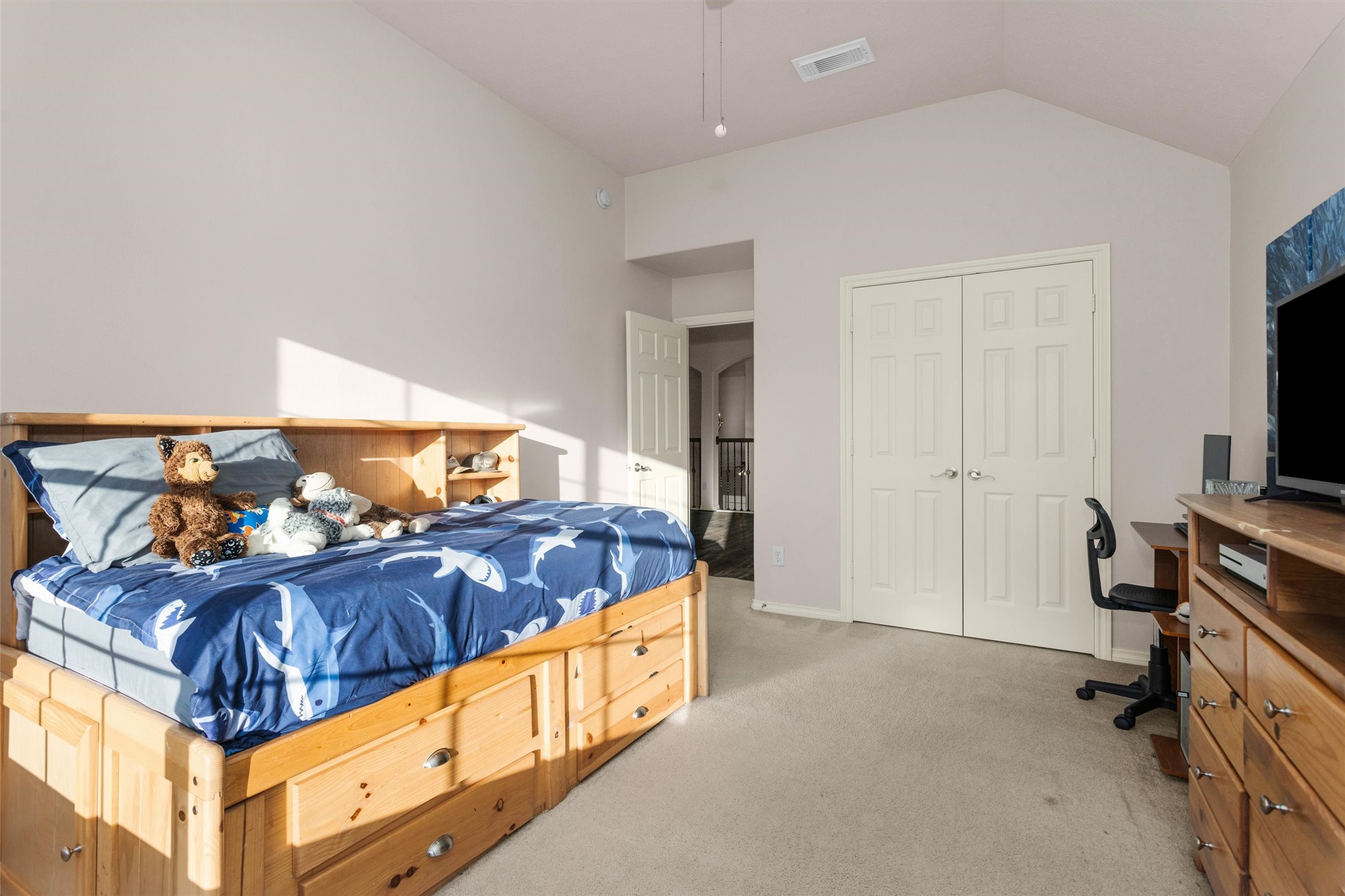30110 Legends Ridge Drive Spring, TX 77386 - Photo 37 of 49 a bedroom with a bed and a flat tv screen on the table
