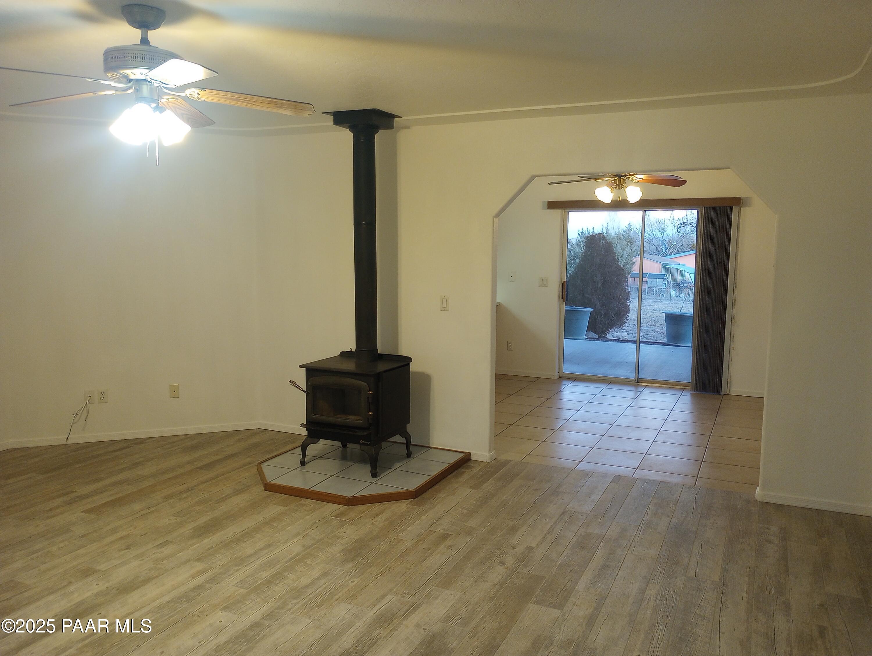 3325 Gopher Drive Chino Valley, AZ 86323 - Photo 3 of 19 a view of a livingroom with furniture a chandelier and wooden floor