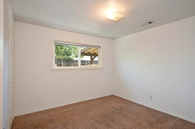 a view of empty room with windows