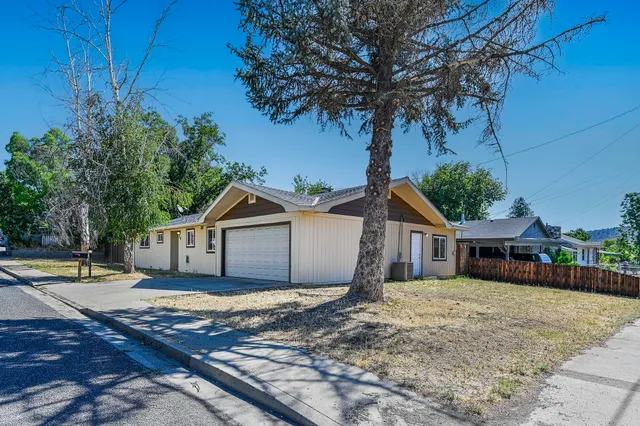 a house with trees in the background