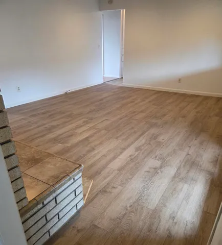 a view of a storage and utility room with washer and dryer