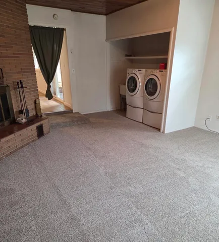 a view of room with window and hardwood floor