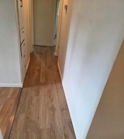 a view of a livingroom with wooden floor