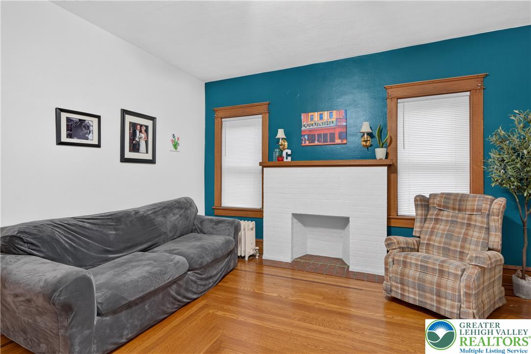 534 Ridge Street Emmaus, PA 18049 - Photo 6 of 40 a living room with furniture and a fireplace