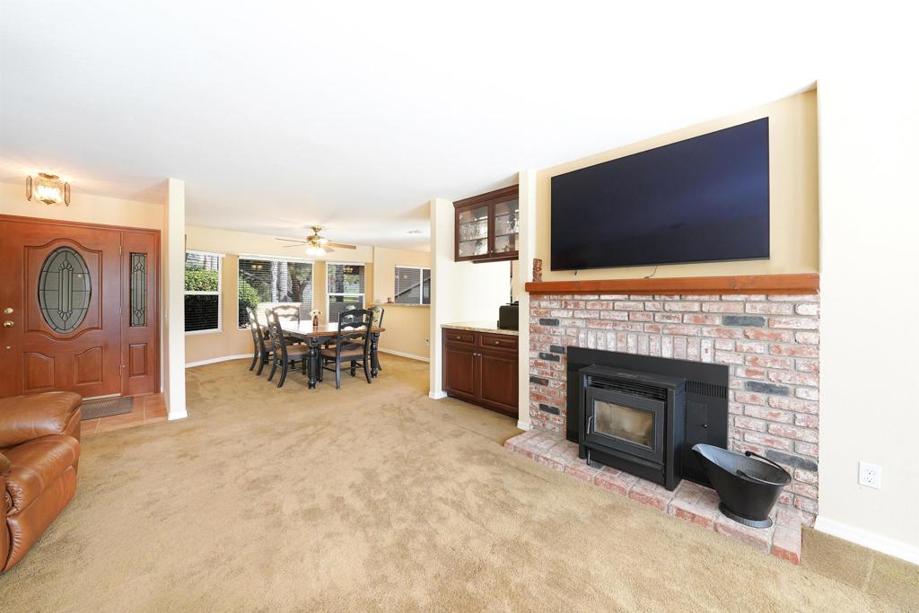341 Pile Street Ramona, CA 92065 - Photo 18 of 50 a living room with furniture a flat screen tv and a fireplace