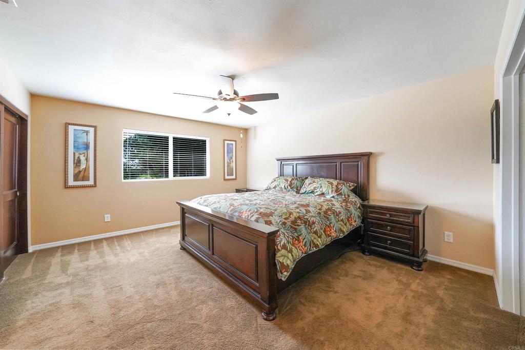 341 Pile Street Ramona, CA 92065 - Photo 23 of 50 a bed sitting in a bedroom next to a window