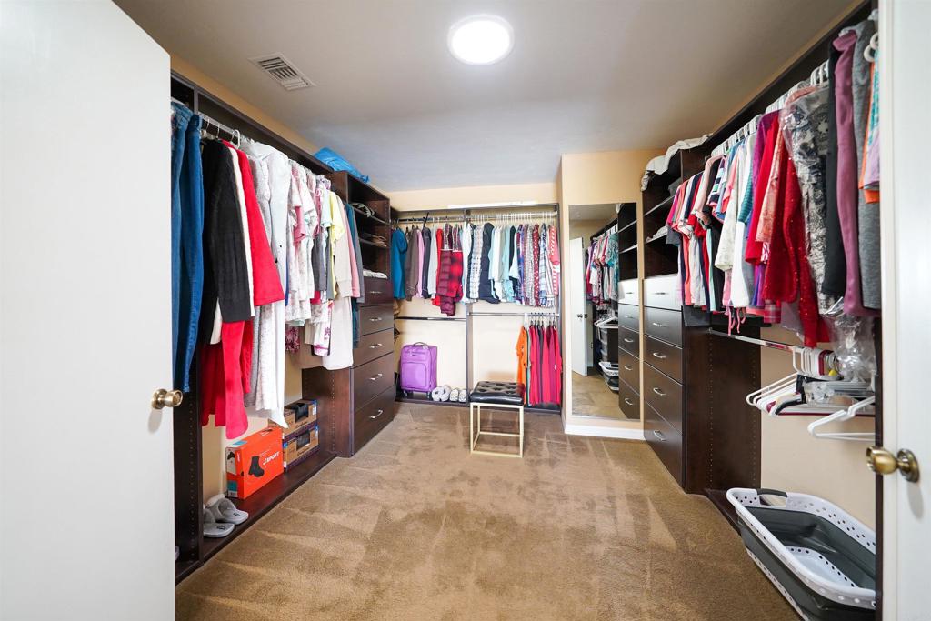 341 Pile Street Ramona, CA 92065 - Photo 25 of 50 a view of walk in closet with clothes and shoes