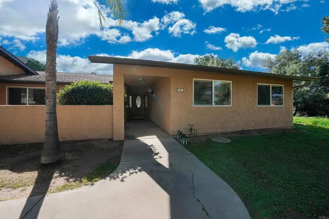 a view of a building with a tree