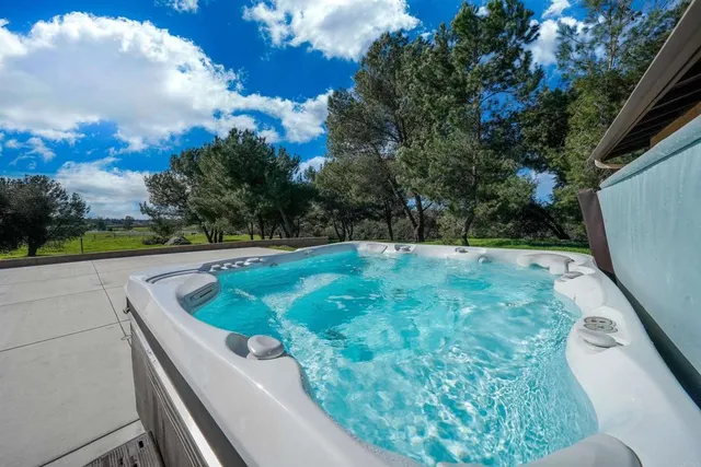 a kitchen with stainless steel appliances granite countertop a stove refrigerator and cabinets