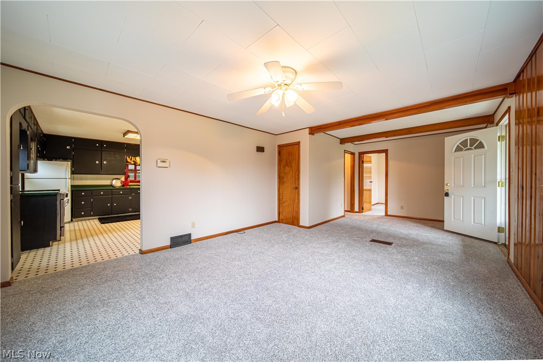 4639 Webb Road Perry, OH 44081 - Photo 6 of 34 Living room entrance opens to the large kitchen.